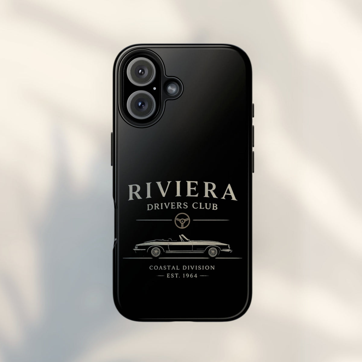 JJ Luxury House Riviera Drivers telefoonhoesje in glanzend zwart met een vintage cabriolet en stuurwiel icoon.